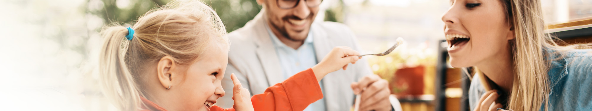 child, woman and man eating