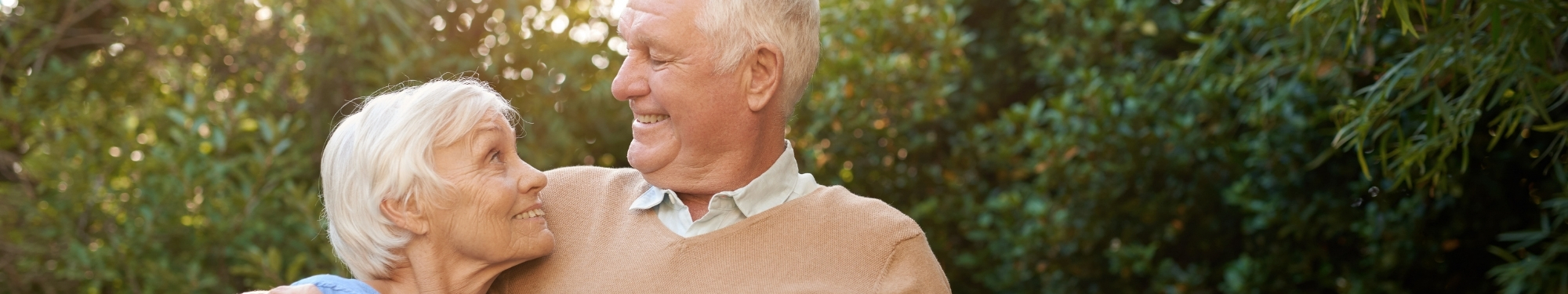 older couple looking at each other happily