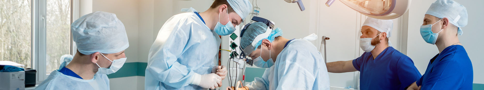 doctors and nurses performing surgery